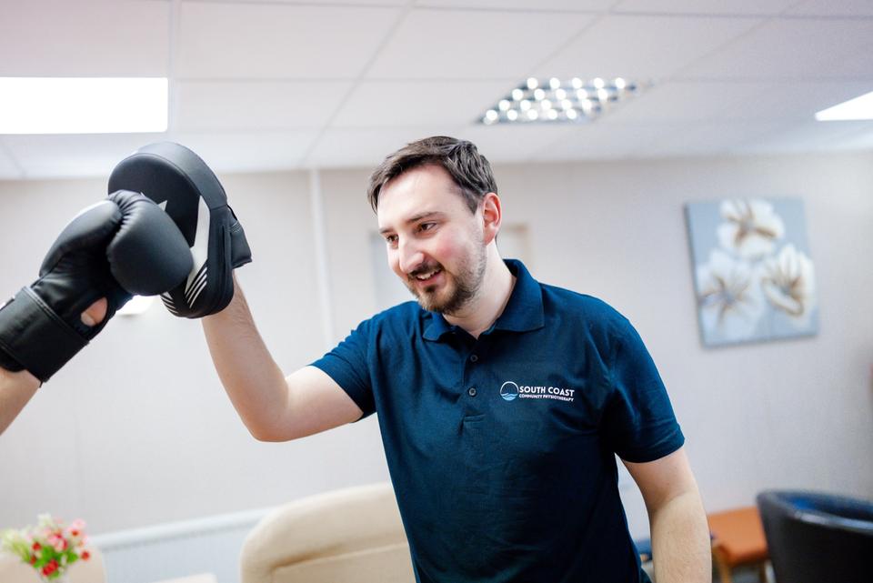 Boxing pad work with a physiotherapist