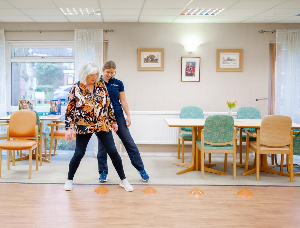 Stepping between cones with a physiotherapist