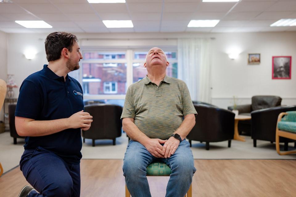 Seated neck mobility exercise