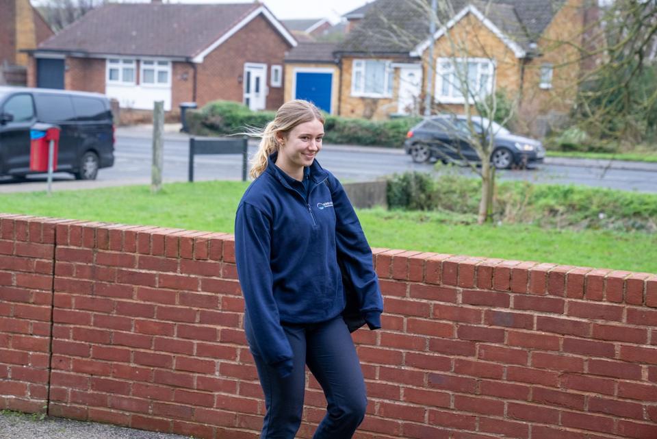 A physiotherapist arriving for a home visit